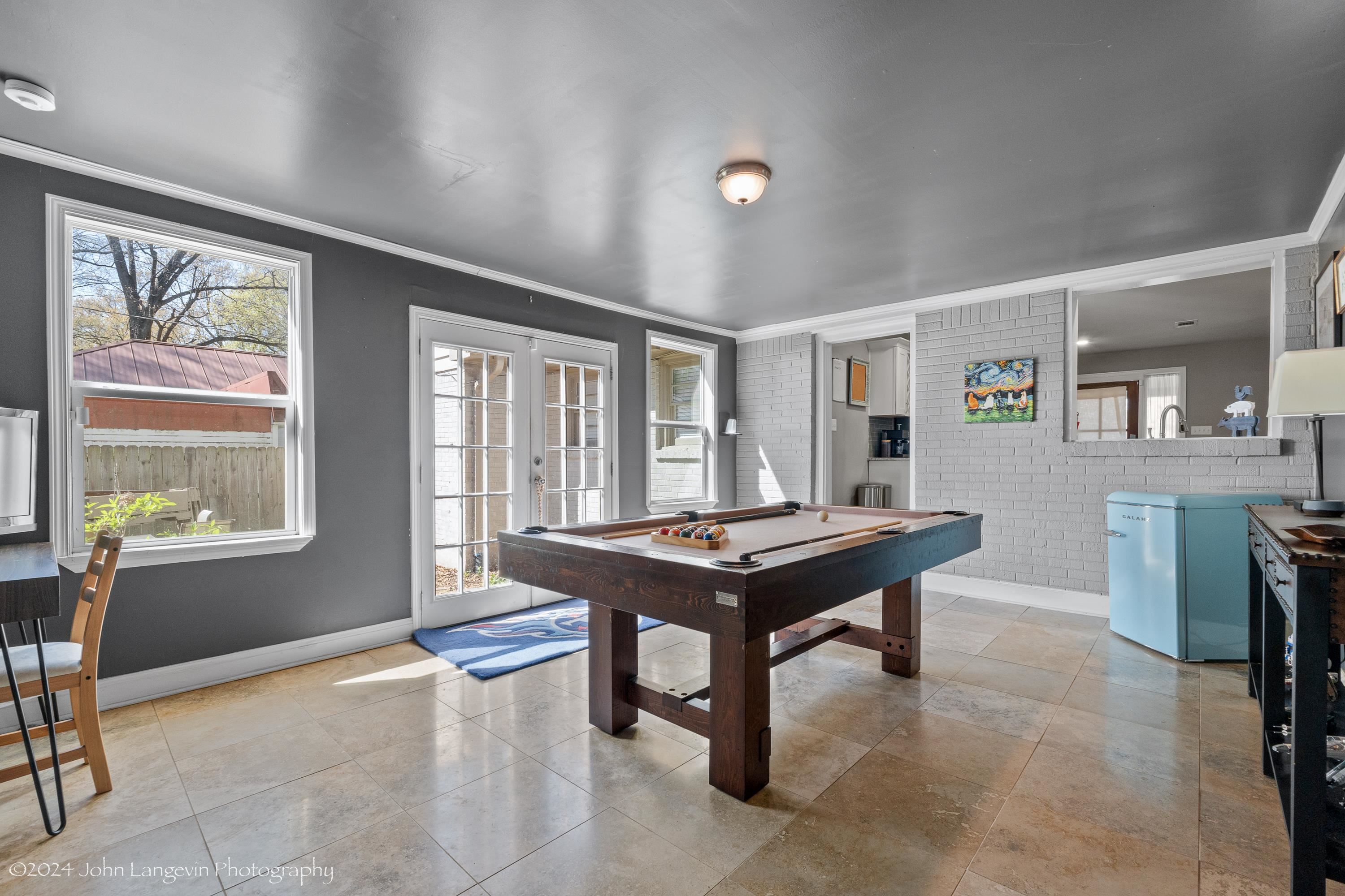 3381 Walnut Grove Road Memphis, TN 38111 - Photo 18 of 25 a room with furniture a large window and a table