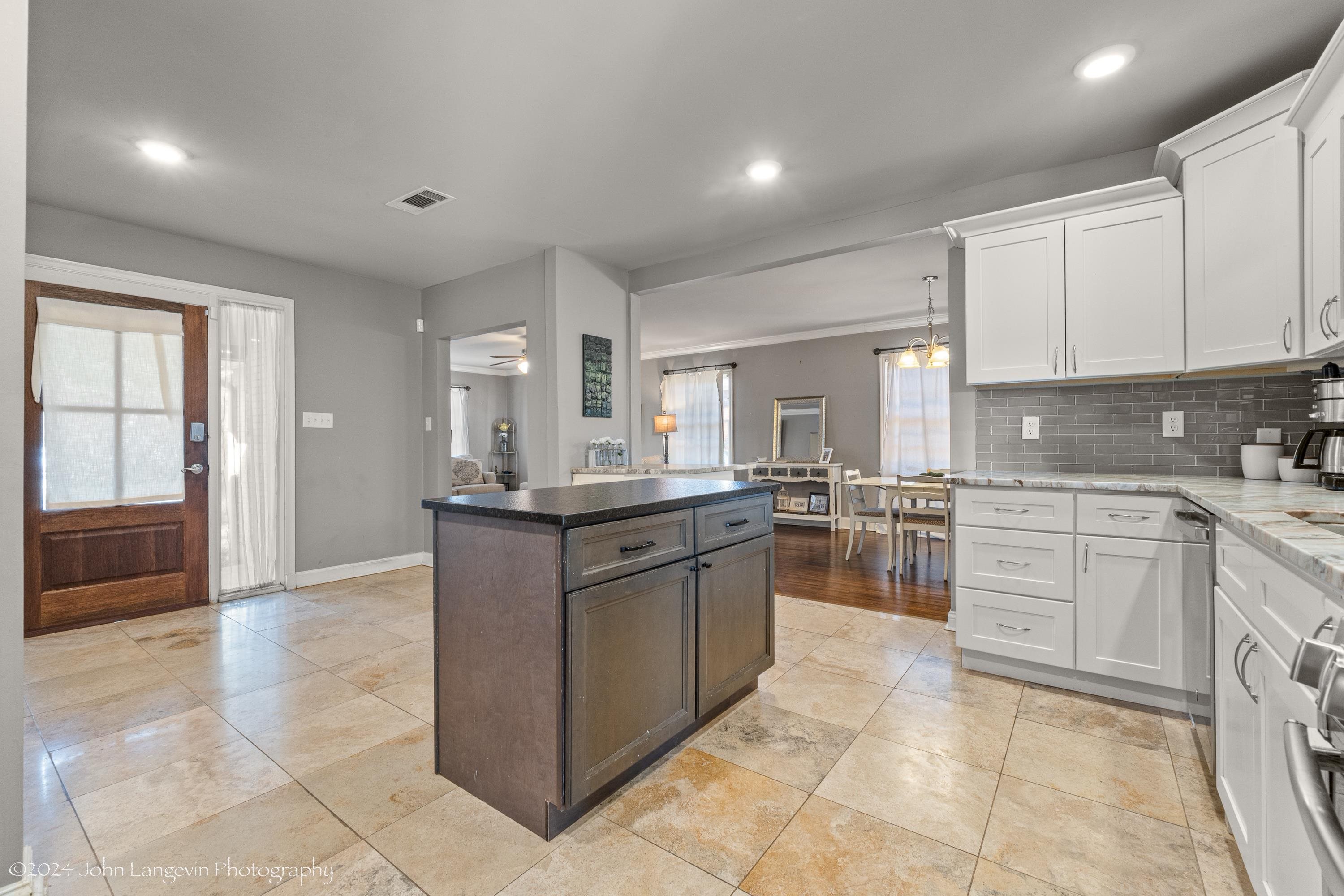 3381 Walnut Grove Road Memphis, TN 38111 - Photo 20 of 25 a kitchen with stainless steel appliances granite countertop a stove and a sink