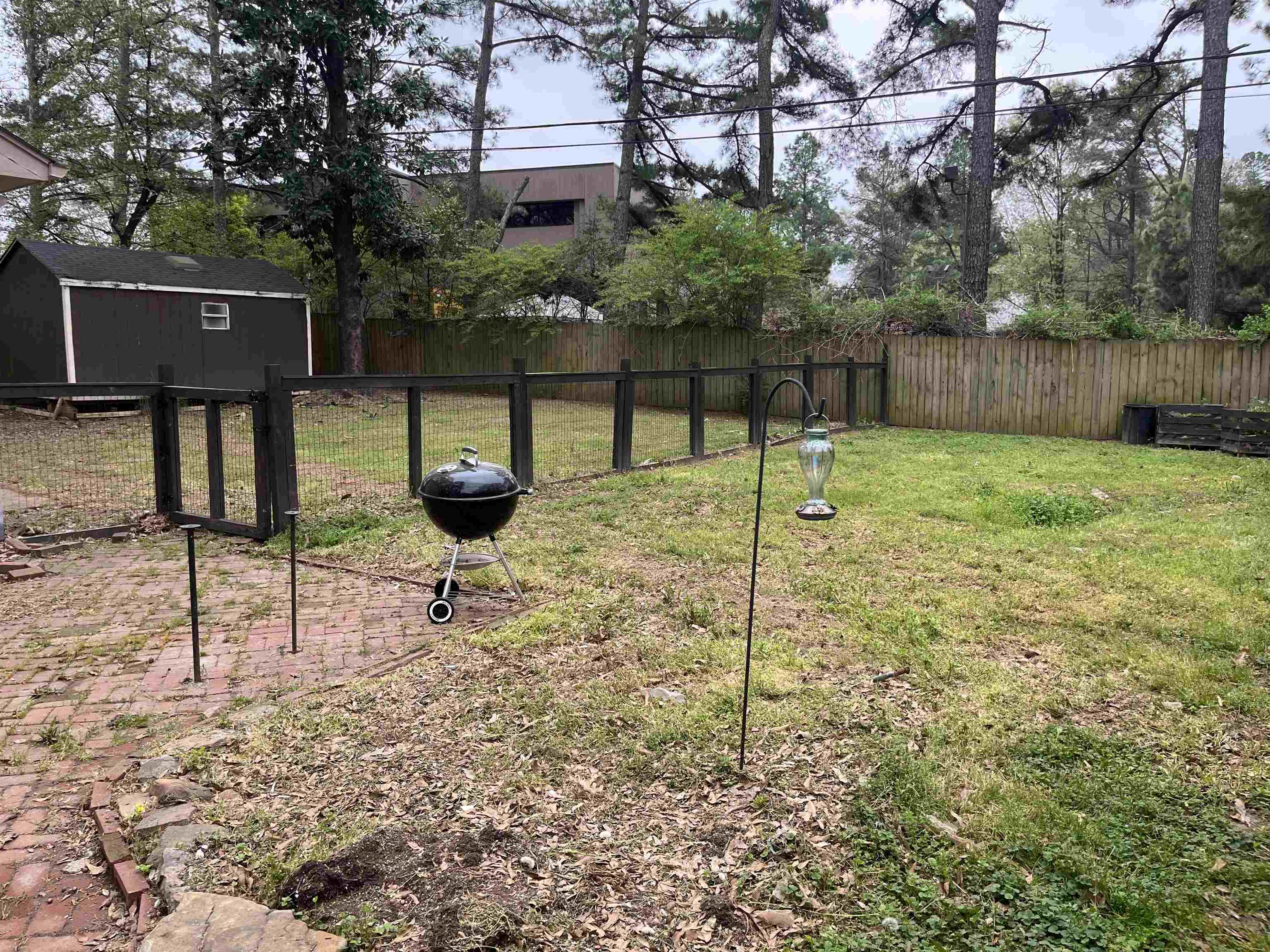 3381 Walnut Grove Road Memphis, TN 38111 - Photo 24 of 25 a backyard of a house with table and chairs