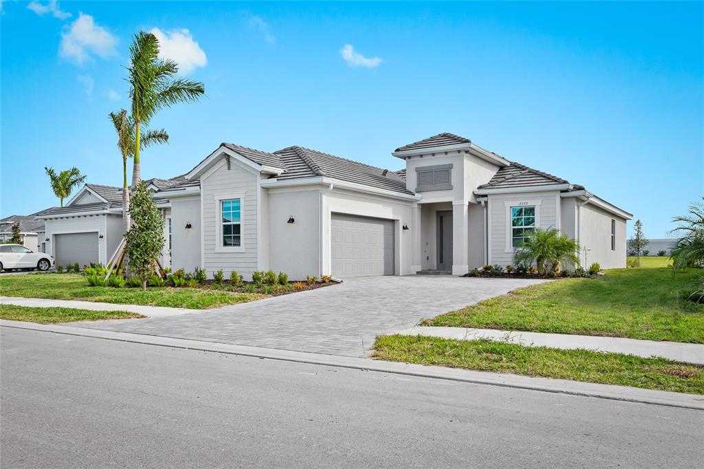 17370 Jadestone Court Venice, FL 34293 - Photo 1 of 1 a front view of a house with a yard and garage