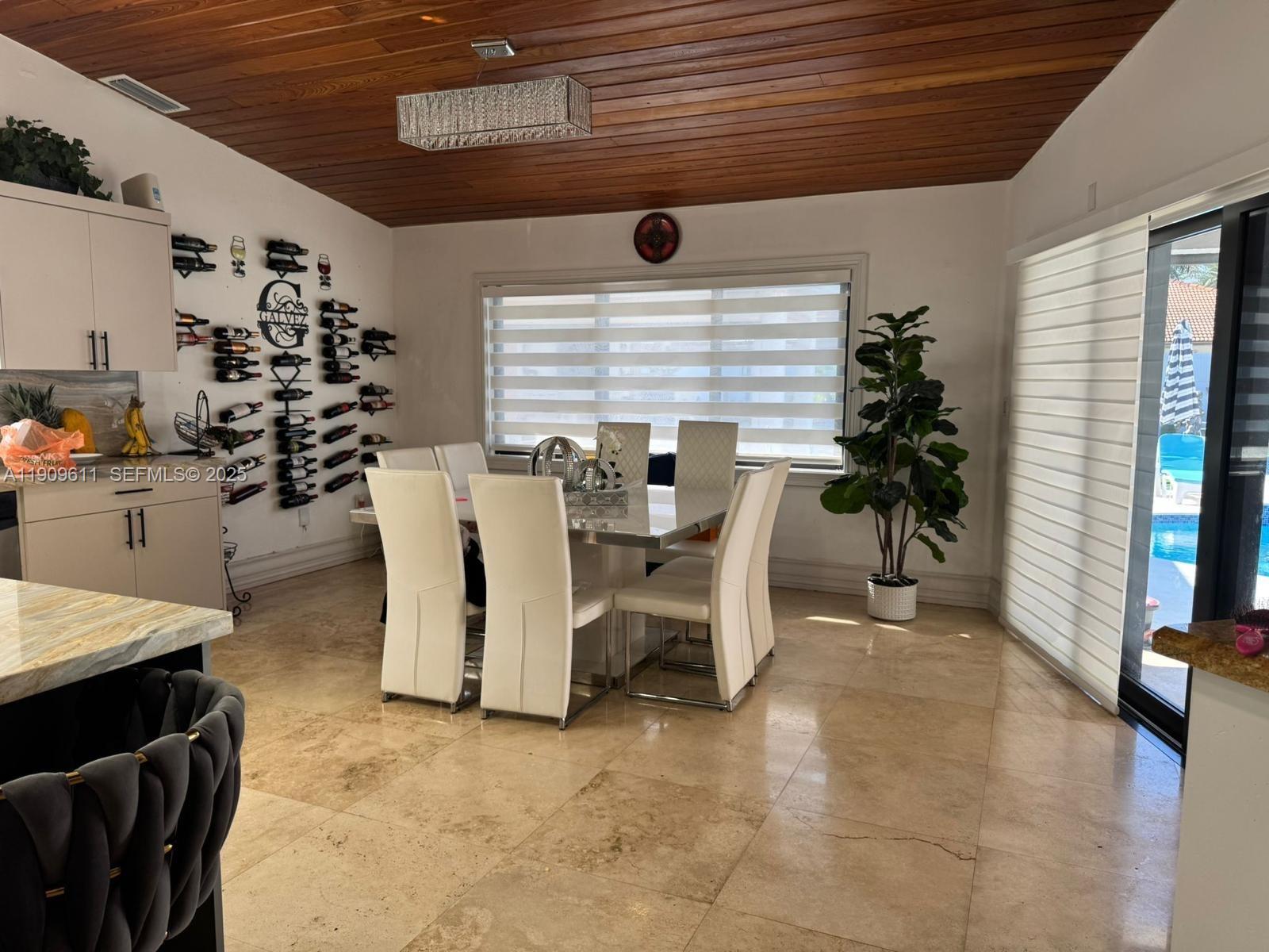 3690 Southwest 139th Avenue Miami, FL 33175 - Photo 6 of 11 a view of a dining room with furniture and window