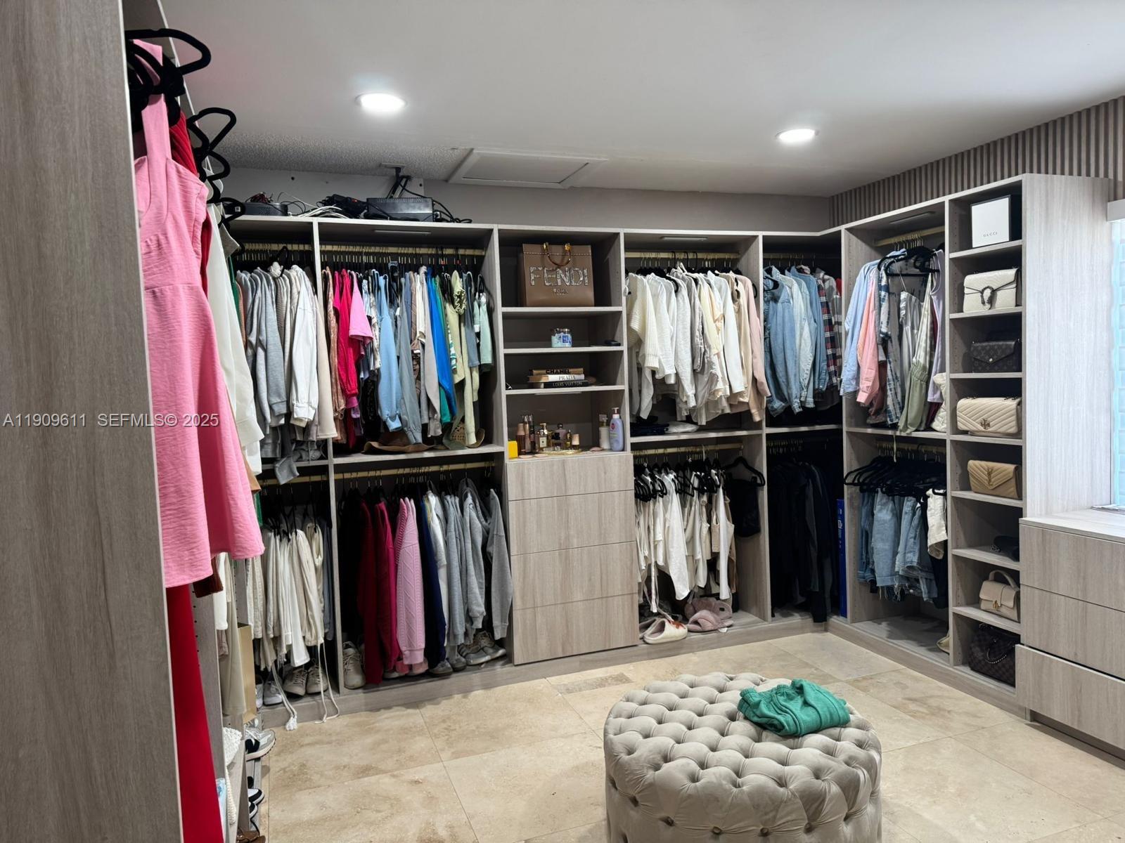 3690 Southwest 139th Avenue Miami, FL 33175 - Photo 7 of 11 a view of walk in closet with clothes and shoes