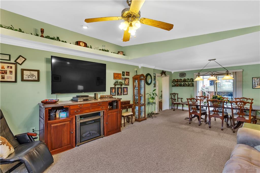 213 Whittier Street Vandergrift, PA 15690 - Photo 17 of 37 a living room with furniture and a flat screen tv
