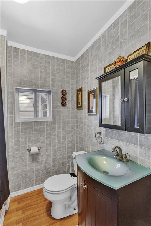 213 Whittier Street Vandergrift, PA 15690 - Photo 23 of 37 a bathroom with a granite countertop sink and a mirror