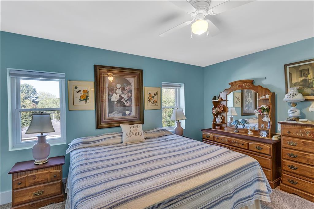 213 Whittier Street Vandergrift, PA 15690 - Photo 24 of 37 a bedroom with a bed and a chandelier