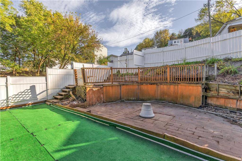 213 Whittier Street Vandergrift, PA 15690 - Photo 34 of 37 a view of a backyard with wooden fence