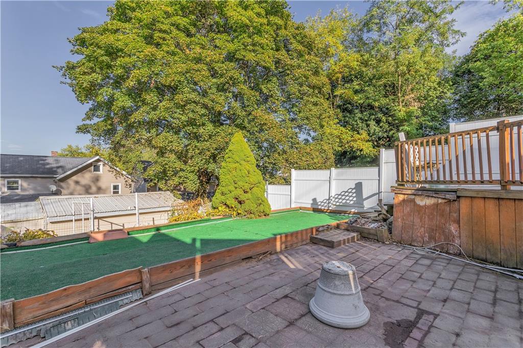 213 Whittier Street Vandergrift, PA 15690 - Photo 35 of 37 a view of a chair and table in backyard