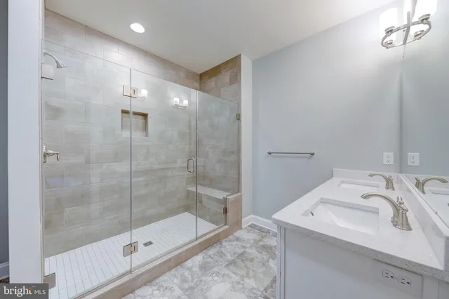 a bathroom with a sink and a shower