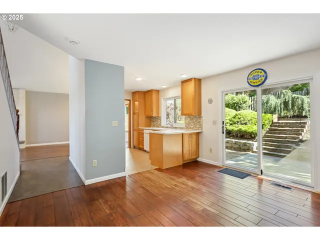 a view interior of a house wooden floor kitchen view and an empty room