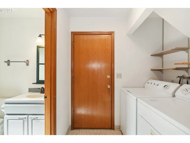 a utility room with closet dryer and washer