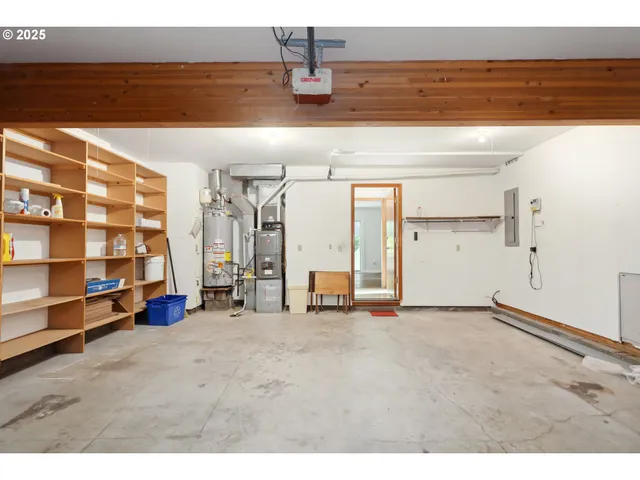 a view of a room with wooden floor and cabinet