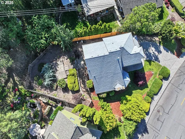an aerial view of a house with a garden