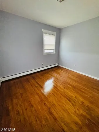 a view of an empty room with windows