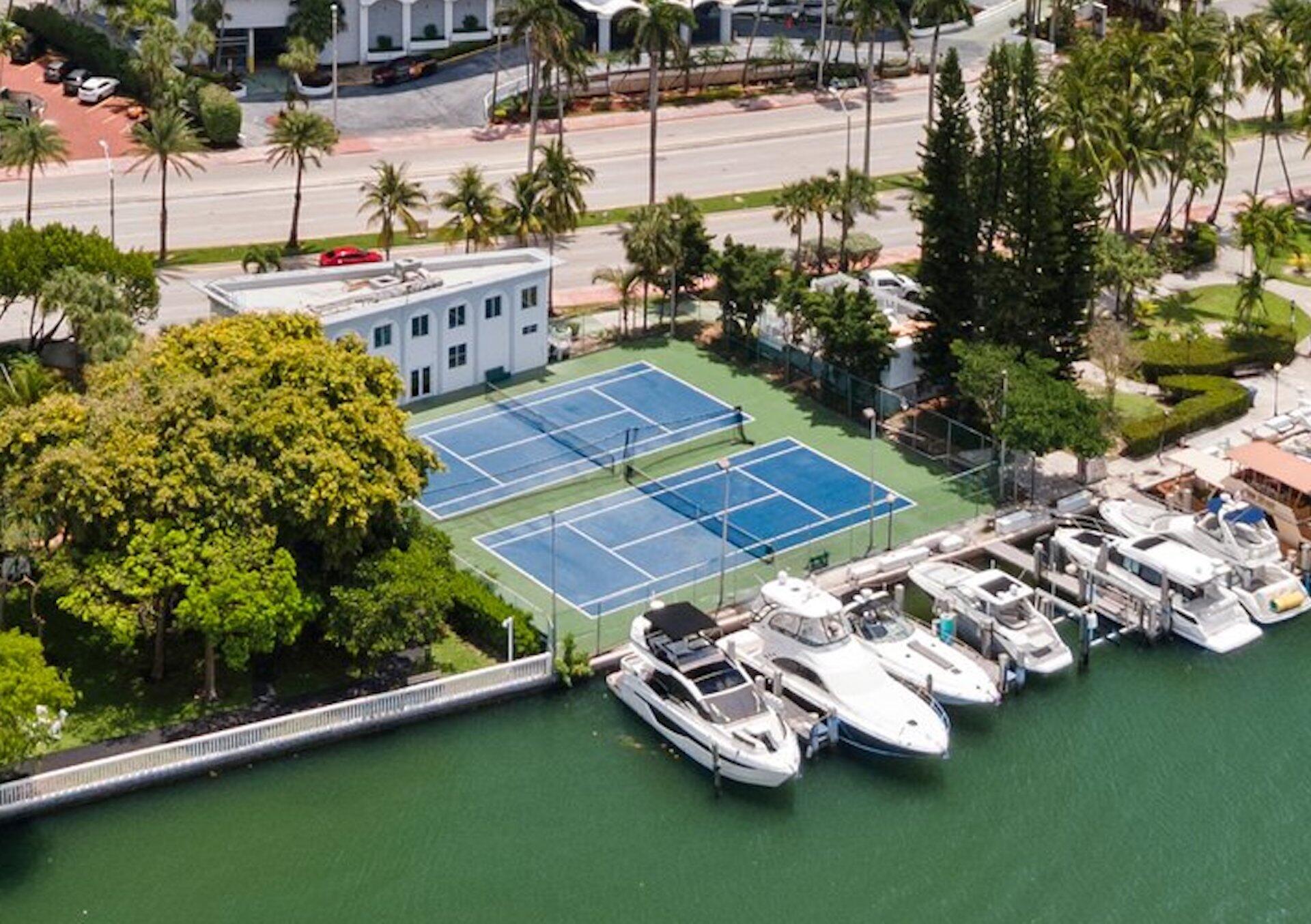 5401 Collins Avenue, Unit 622 Miami Beach, FL 33140 - Photo 4 of 4 a view of a backyard with plants and lake view