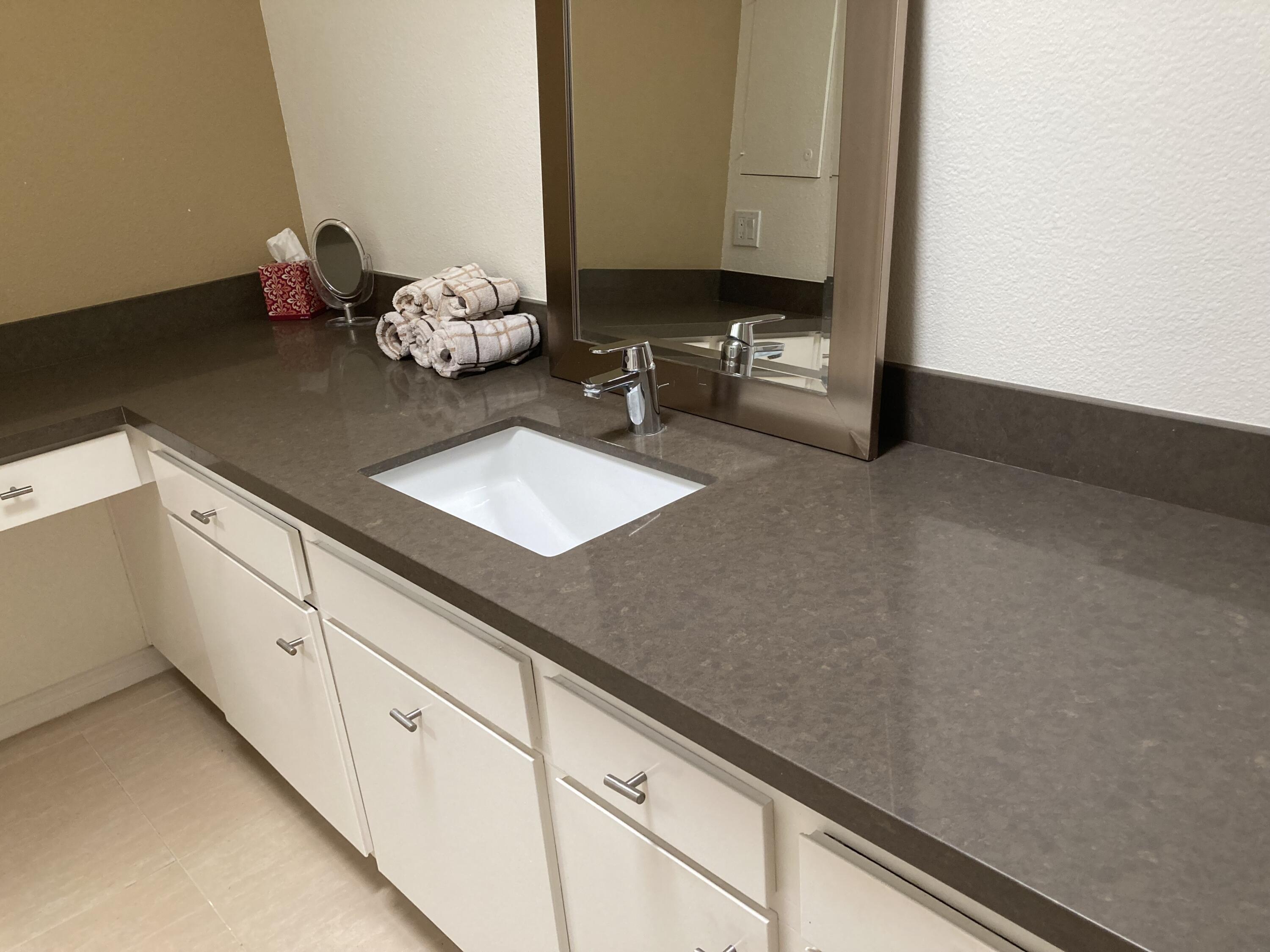 45760 Pima Road Indian Wells, CA 92210 - Photo 18 of 28 a kitchen with a sink and a stove top oven