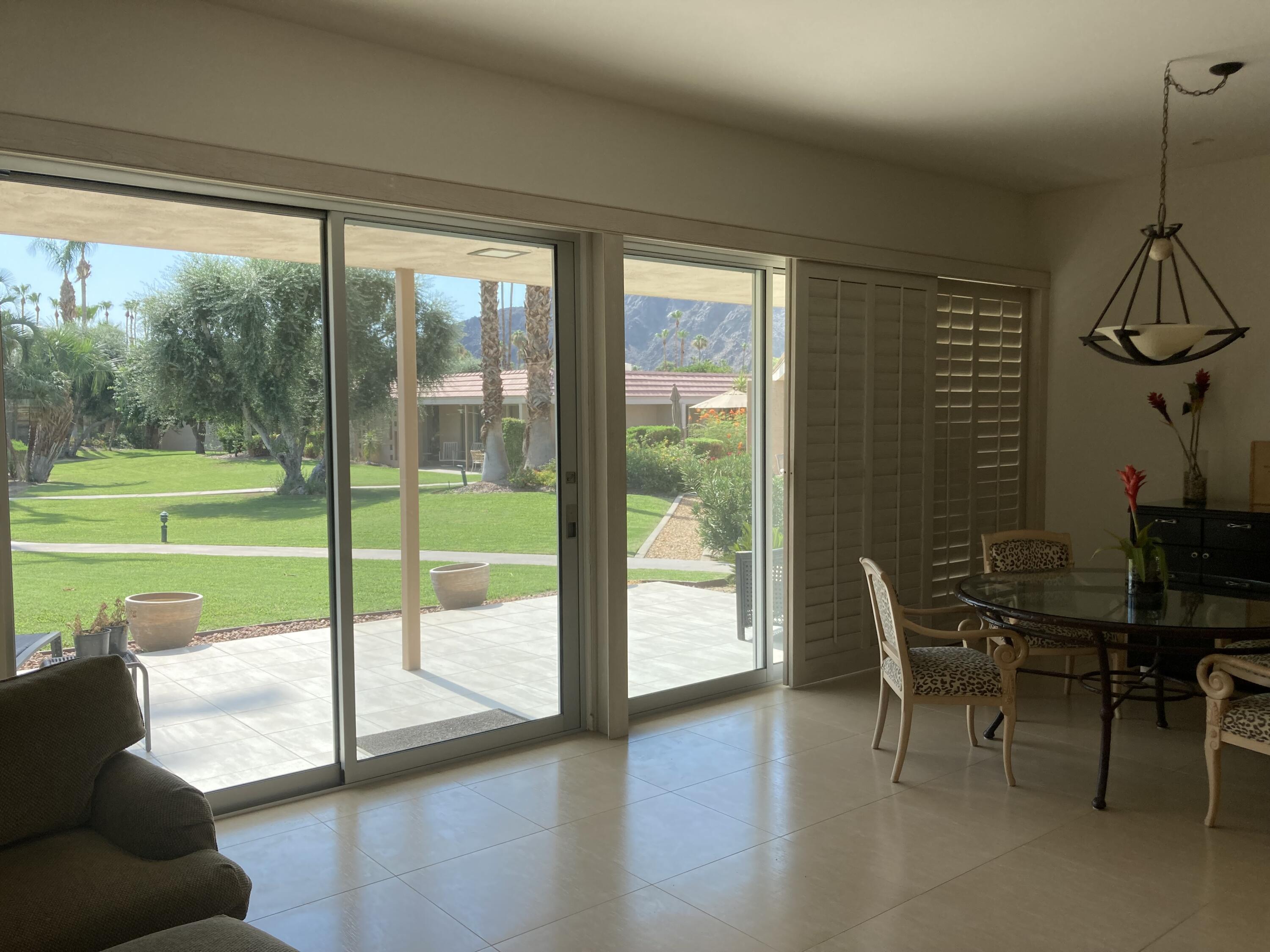 45760 Pima Road Indian Wells, CA 92210 - Photo 3 of 28 a view of a livingroom with furniture and floor to ceiling window