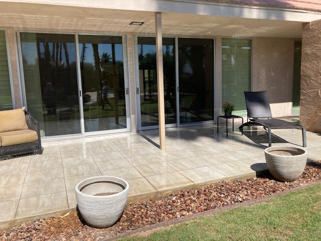 45760 Pima Road Indian Wells, CA 92210 - Photo 24 of 28 a view of a patio with table and chairs and potted plants
