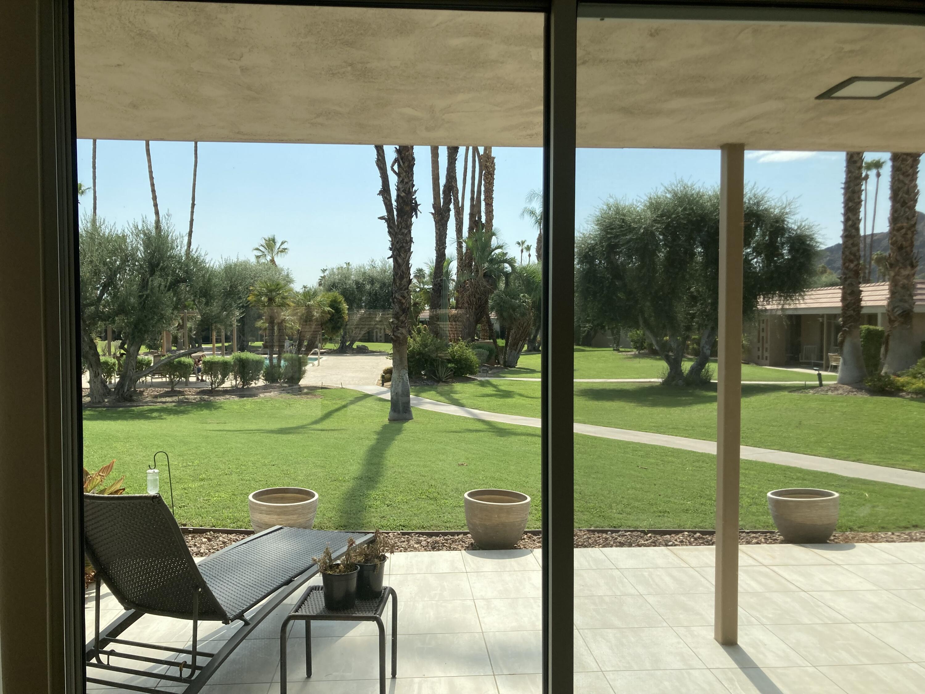 45760 Pima Road Indian Wells, CA 92210 - Photo 26 of 28 a view of a room with porch and a backyard