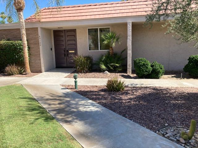 45760 Pima Road Indian Wells, CA 92210 - Photo 28 of 28 a view of a house with a yard and plants