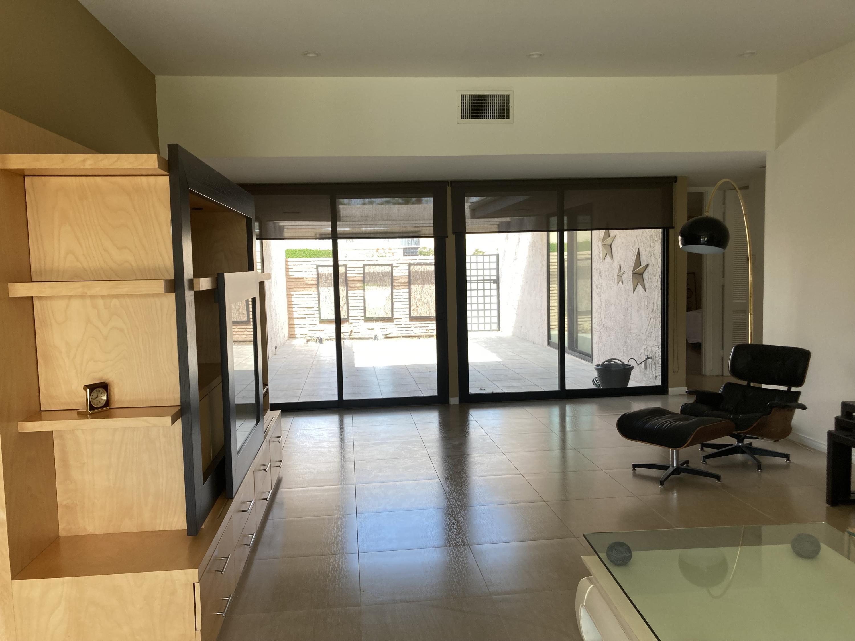 45760 Pima Road Indian Wells, CA 92210 - Photo 5 of 28 a living room with furniture and large windows