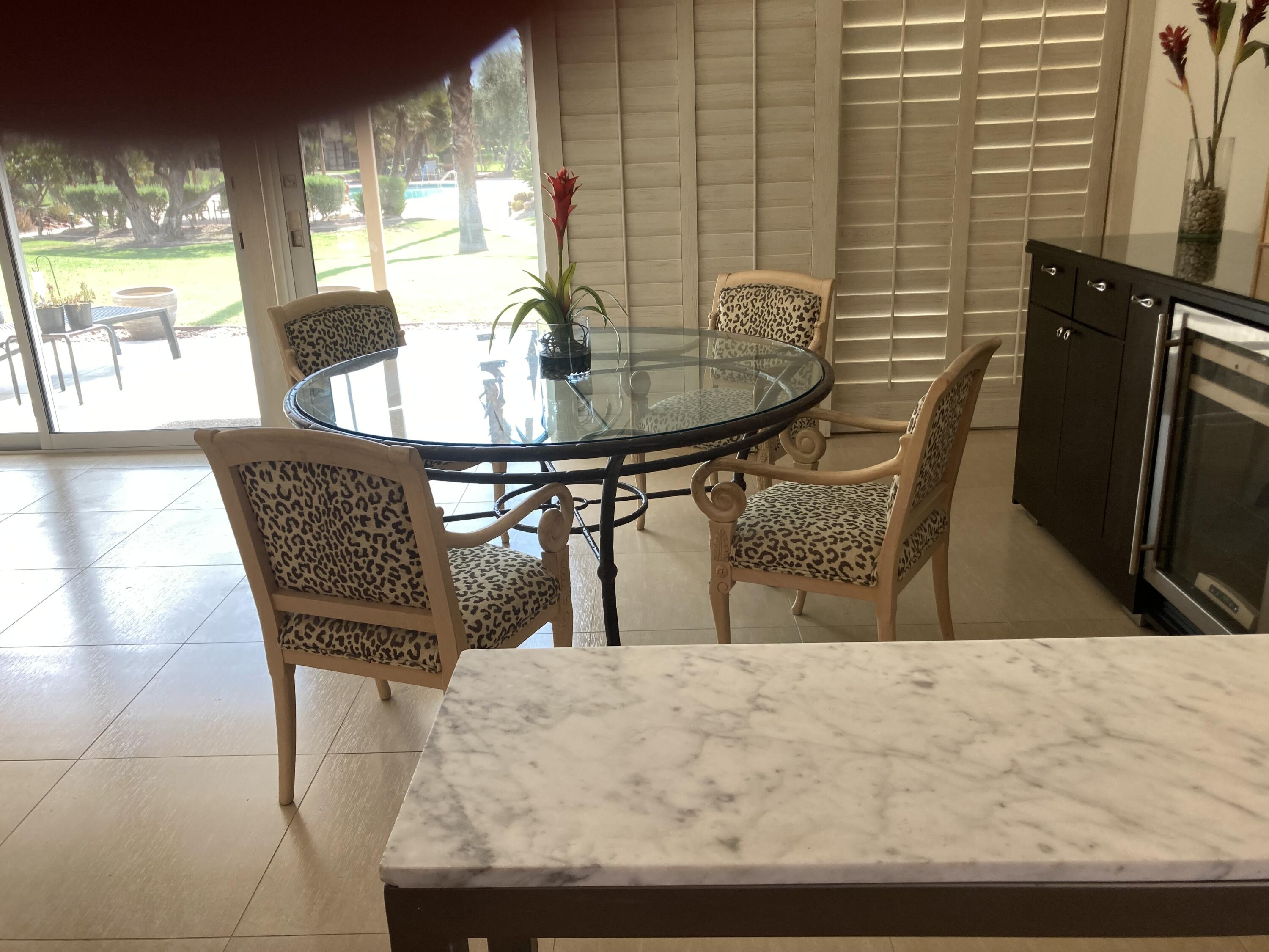 45760 Pima Road Indian Wells, CA 92210 - Photo 6 of 28 a dining room with furniture and window