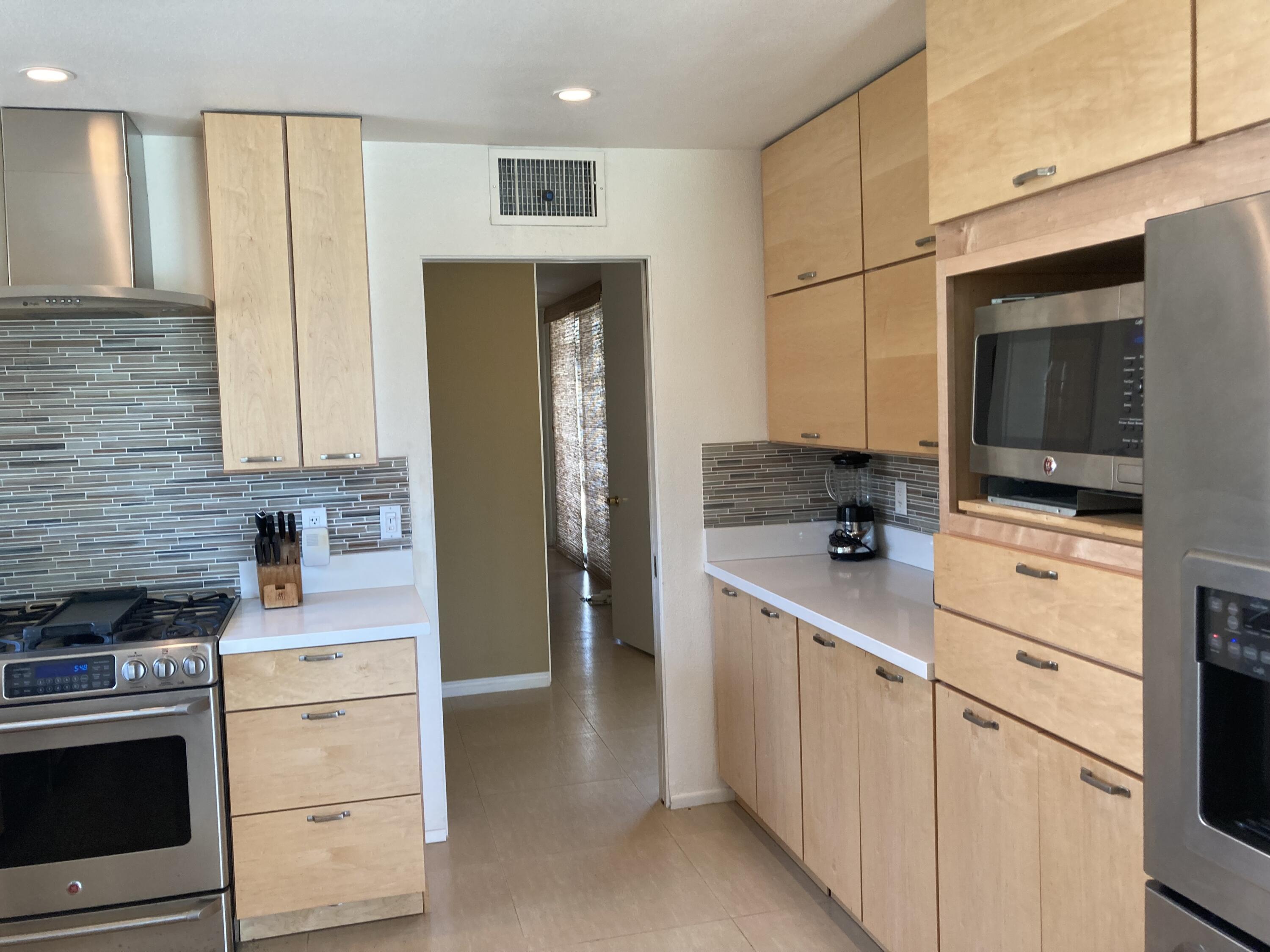 45760 Pima Road Indian Wells, CA 92210 - Photo 8 of 28 a kitchen with a refrigerator stove and sink