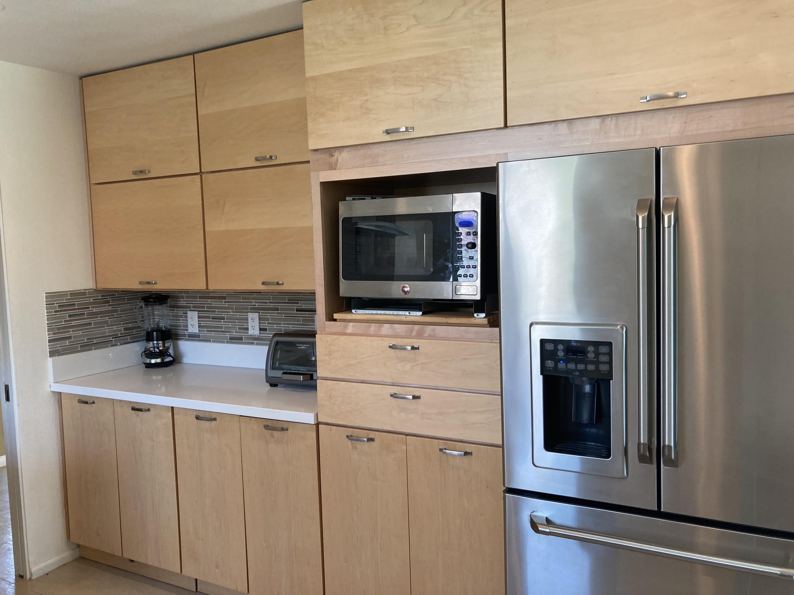 45760 Pima Road Indian Wells, CA 92210 - Photo 9 of 28 a kitchen with stainless steel appliances a refrigerator and cabinets