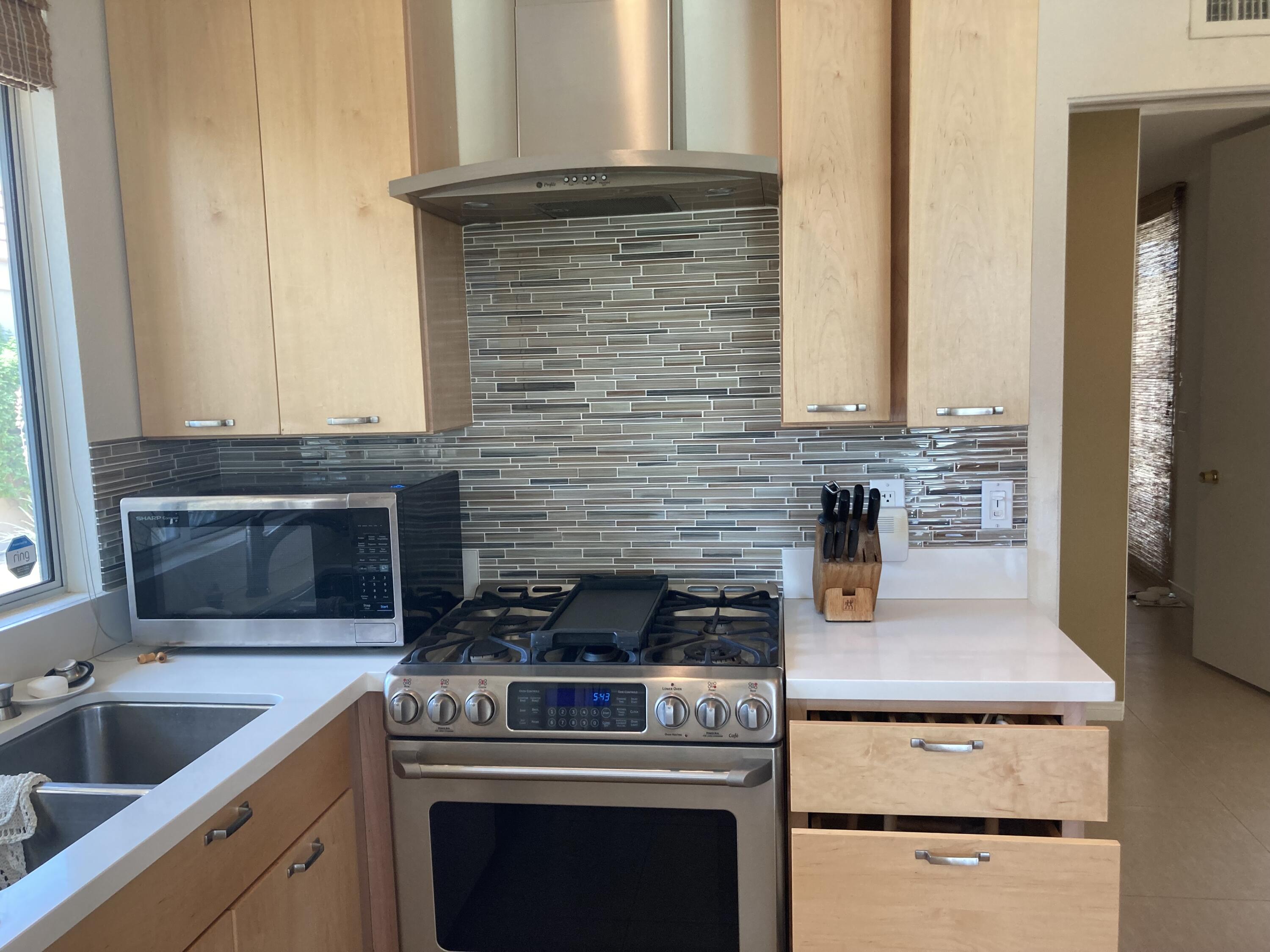 45760 Pima Road Indian Wells, CA 92210 - Photo 10 of 28 a kitchen with a stove and a sink