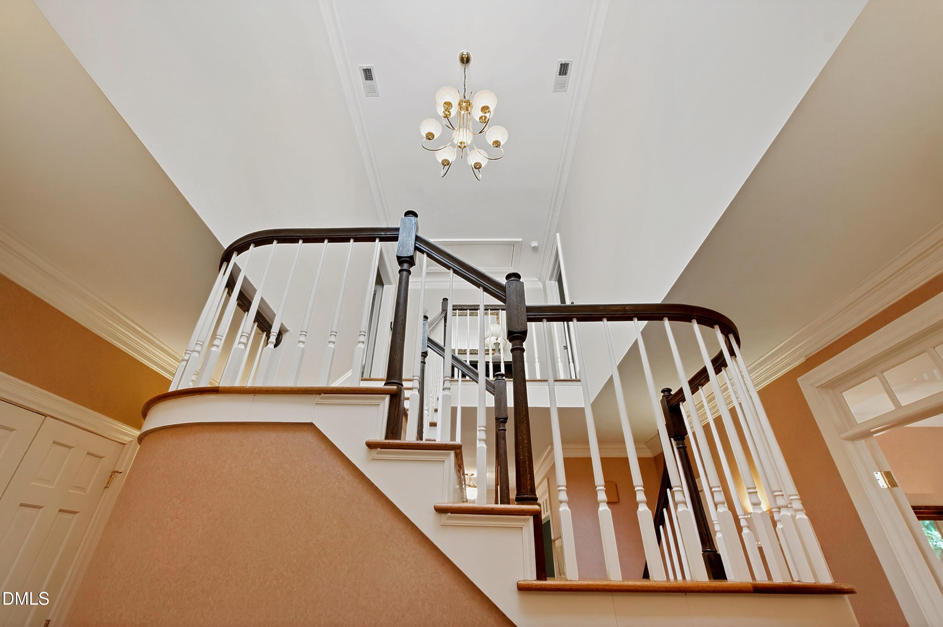 3708 Lubbock Drive Raleigh, NC 27612 - Photo 34 of 64 a view of staircase with railing and white walls