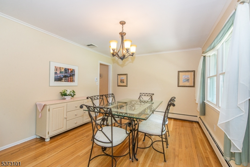 10 Campo Road Randolph, NJ 07869 - Photo 11 of 49 a view of a dining room with furniture and wooden floor
