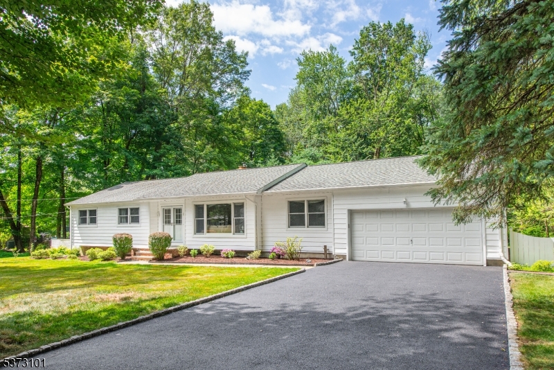 10 Campo Road Randolph, NJ 07869 - Photo 2 of 49 a view of a white house with a large pool and large trees