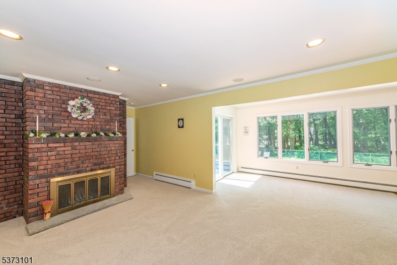 10 Campo Road Randolph, NJ 07869 - Photo 21 of 49 a view of an empty room with a fireplace and a window