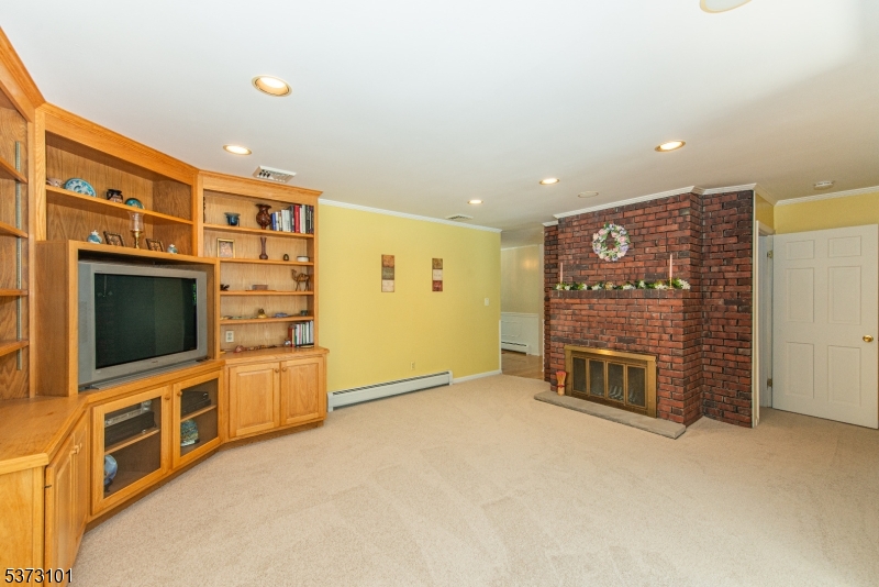10 Campo Road Randolph, NJ 07869 - Photo 22 of 49 a view of an empty room with furniture and flat screen tv