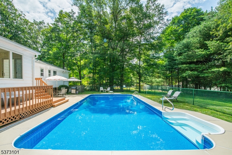 10 Campo Road Randolph, NJ 07869 - Photo 3 of 49 a view of a swimming pool with a patio and a yard