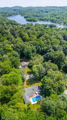 a view of a lake with houses in back