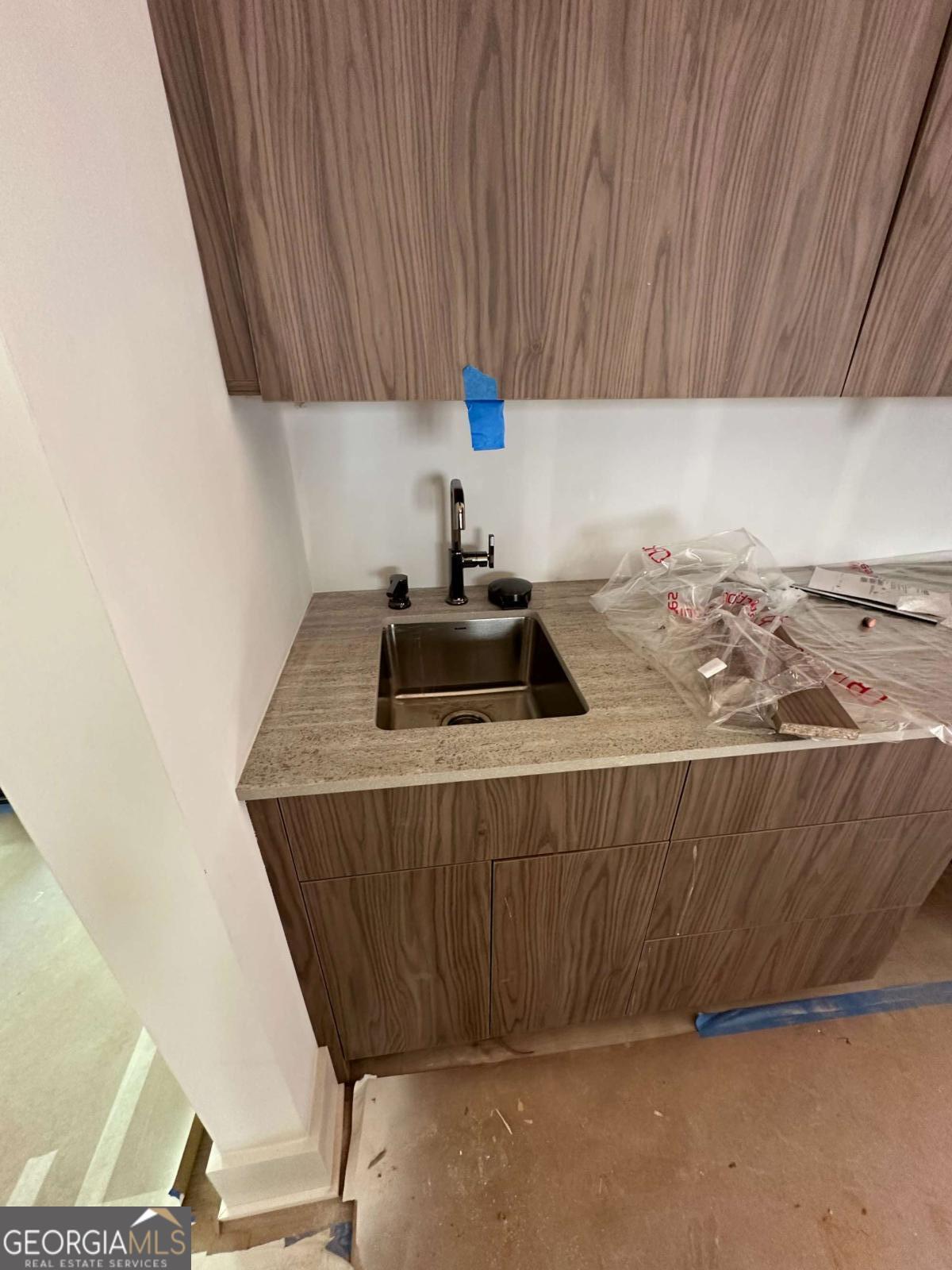 246 Garland Avenue Decatur, GA 30030 - Photo 12 of 17 a kitchen with a sink a stove and a wooden cabinets