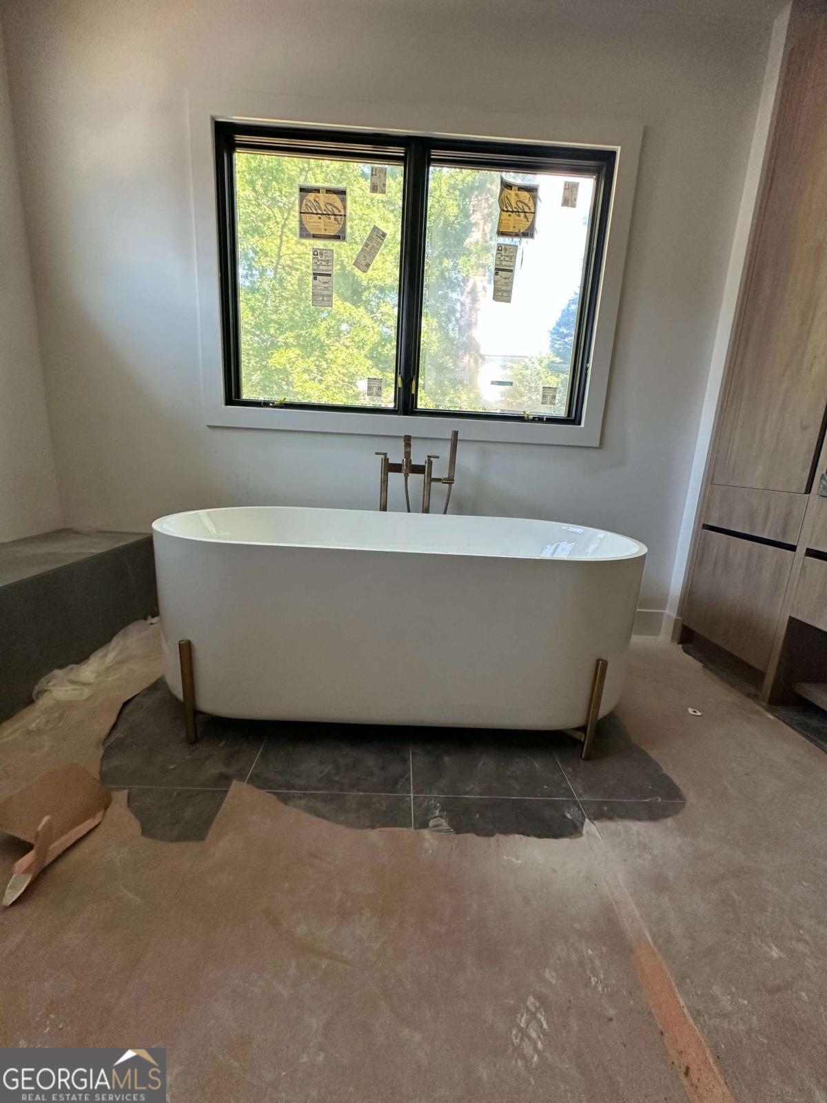 246 Garland Avenue Decatur, GA 30030 - Photo 16 of 17 a bathroom with a bathtub and window