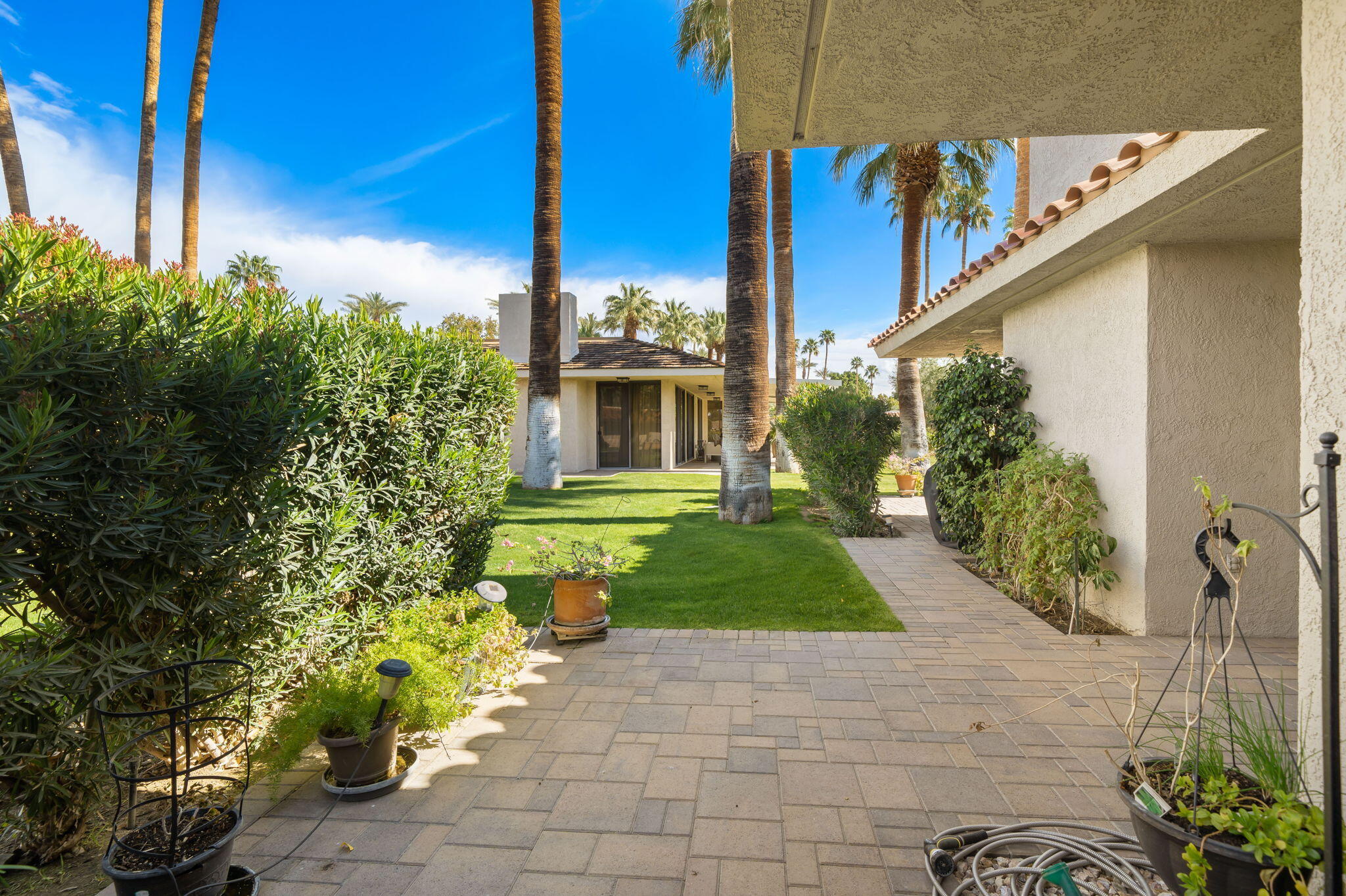 140 Columbia Drive Rancho Mirage, CA 92270 - Photo 12 of 31 a front view of a house with a yard