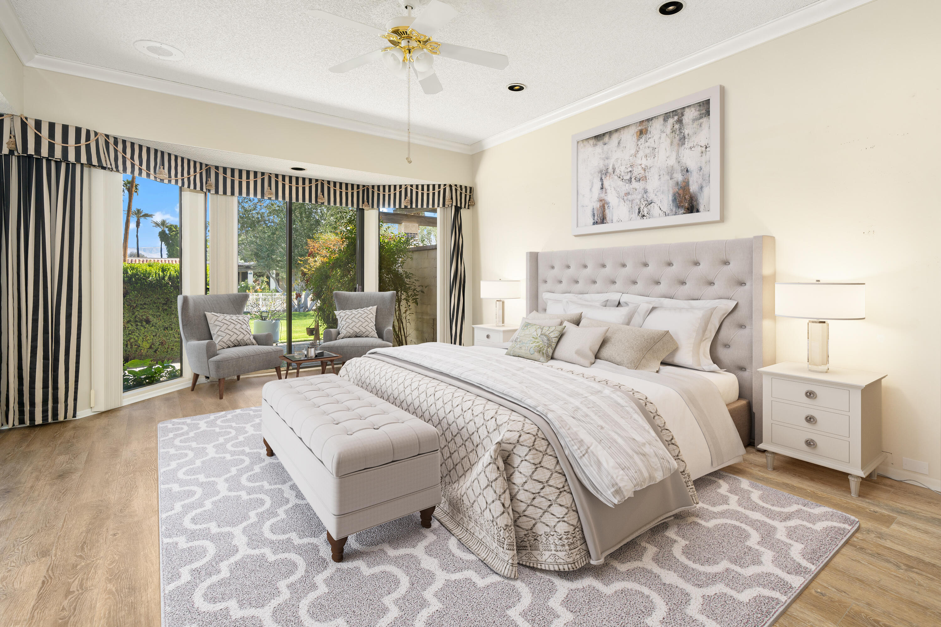 140 Columbia Drive Rancho Mirage, CA 92270 - Photo 14 of 31 a bedroom with a large bed and a large window