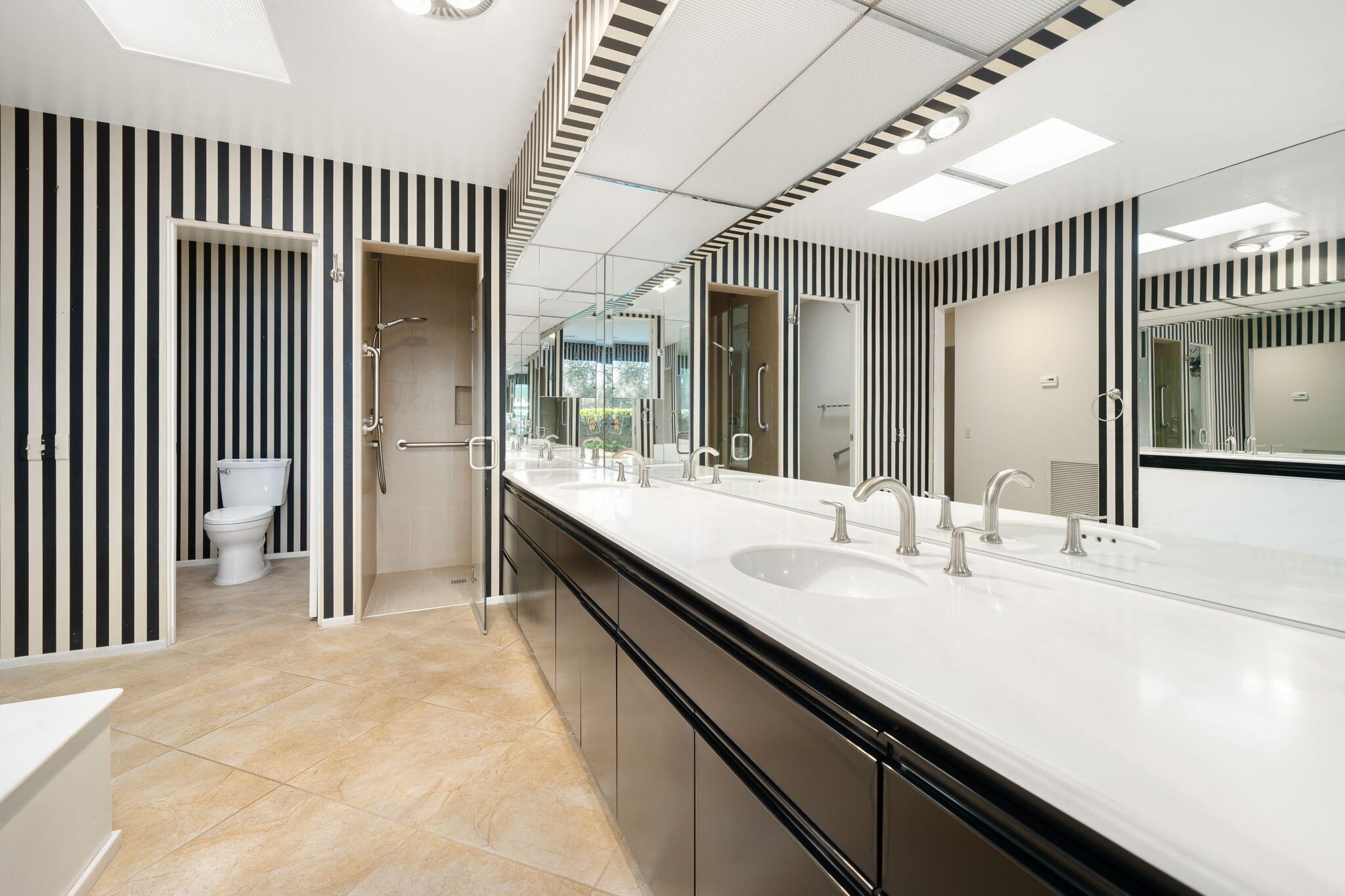 140 Columbia Drive Rancho Mirage, CA 92270 - Photo 18 of 31 a bathroom with a sink and a mirror