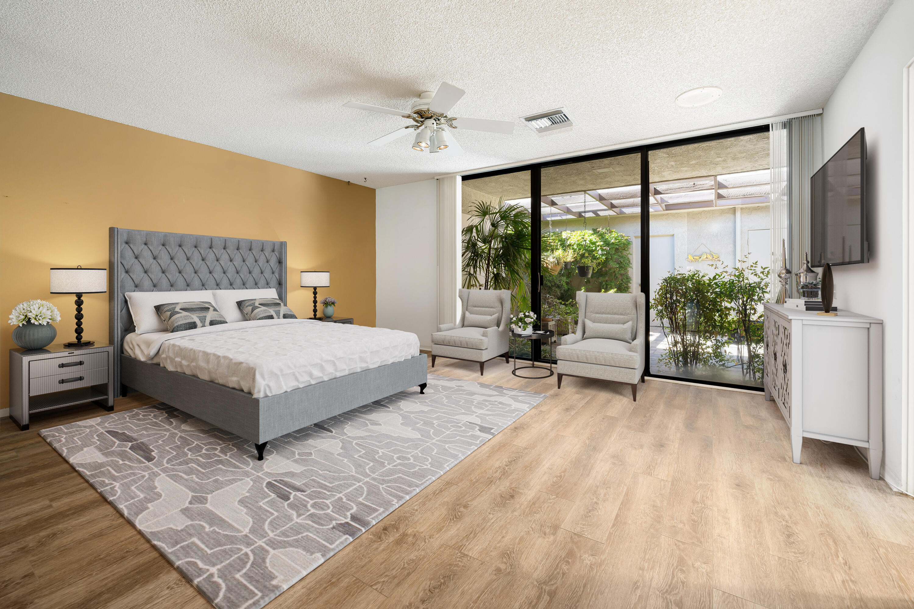 140 Columbia Drive Rancho Mirage, CA 92270 - Photo 19 of 31 a spacious bedroom with a large bed and a flat tv screen
