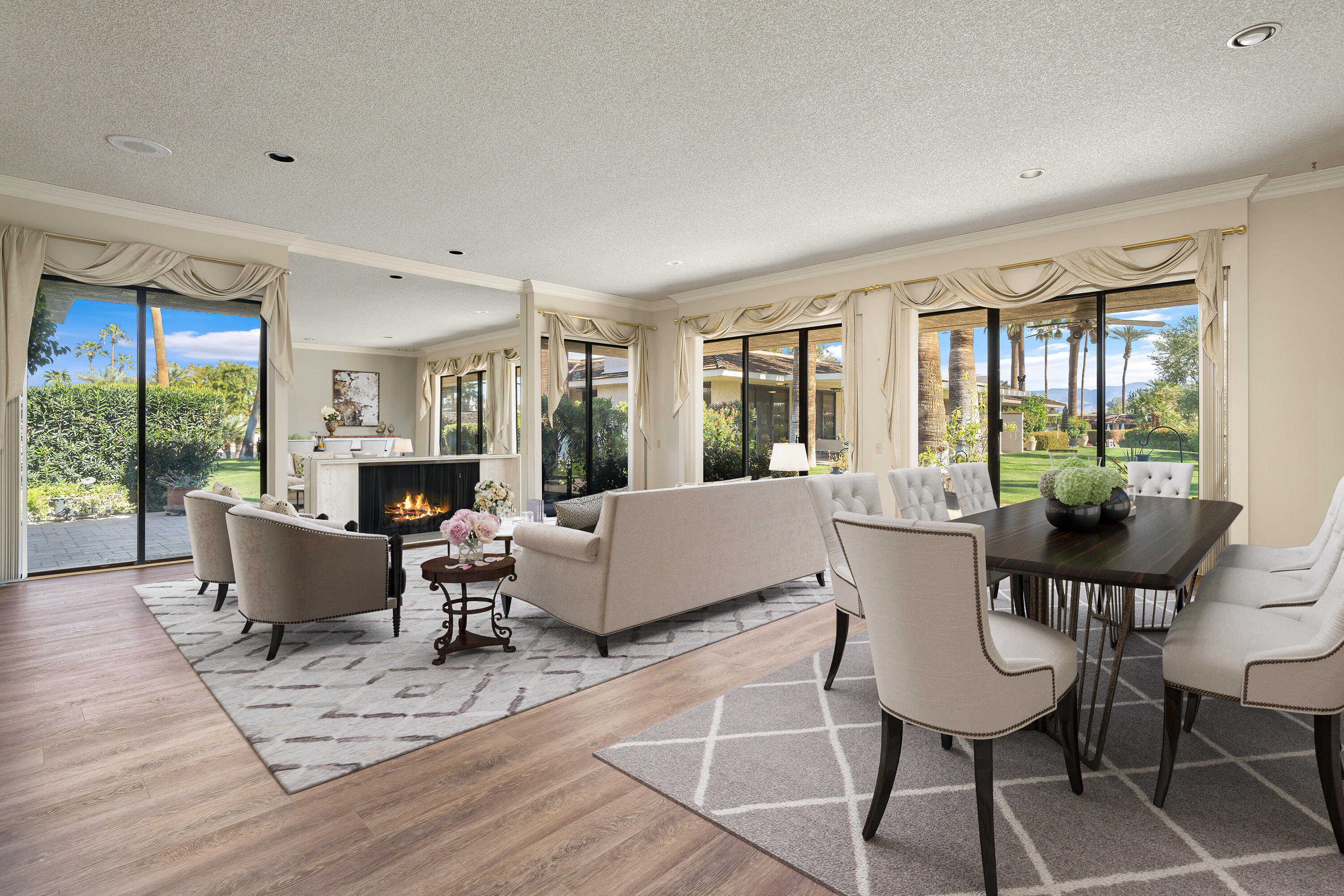 140 Columbia Drive Rancho Mirage, CA 92270 - Photo 2 of 31 a living room with furniture and a fireplace