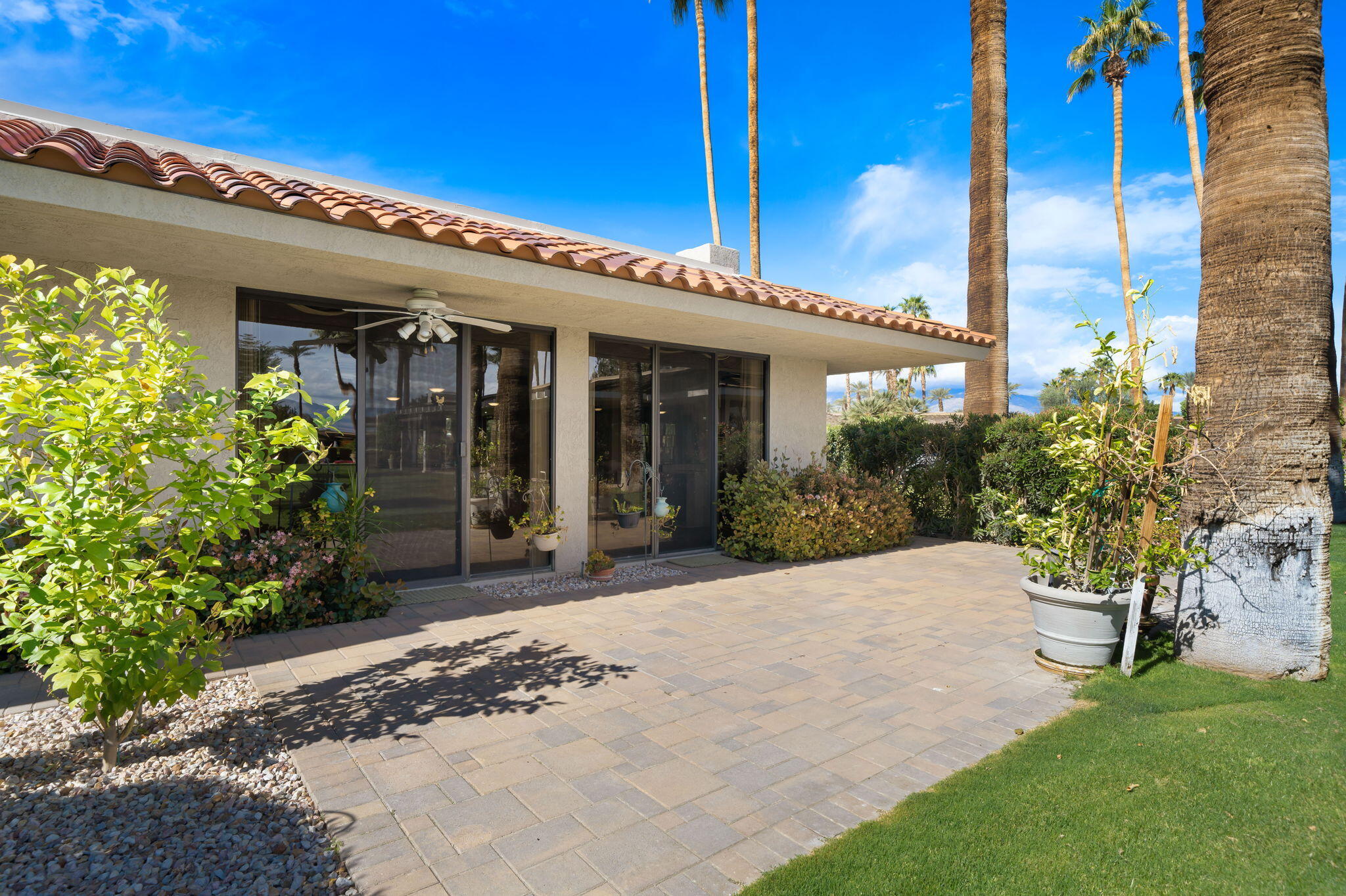 140 Columbia Drive Rancho Mirage, CA 92270 - Photo 29 of 31 a view of a building with a garden