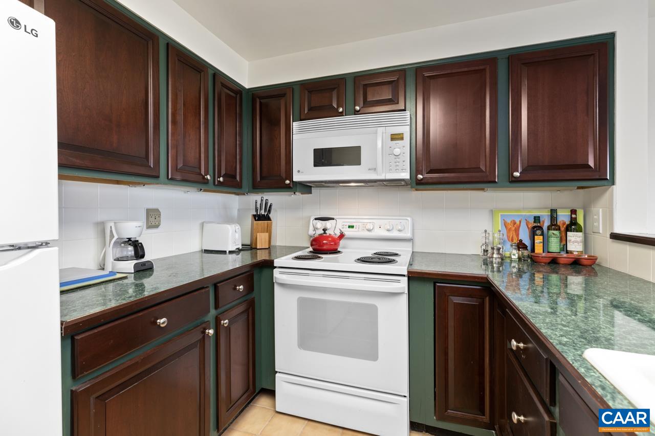 1706 High Ridge Wintergreen, VA 22967 - Photo 13 of 36 a kitchen with stainless steel appliances granite countertop a sink stove and cabinets