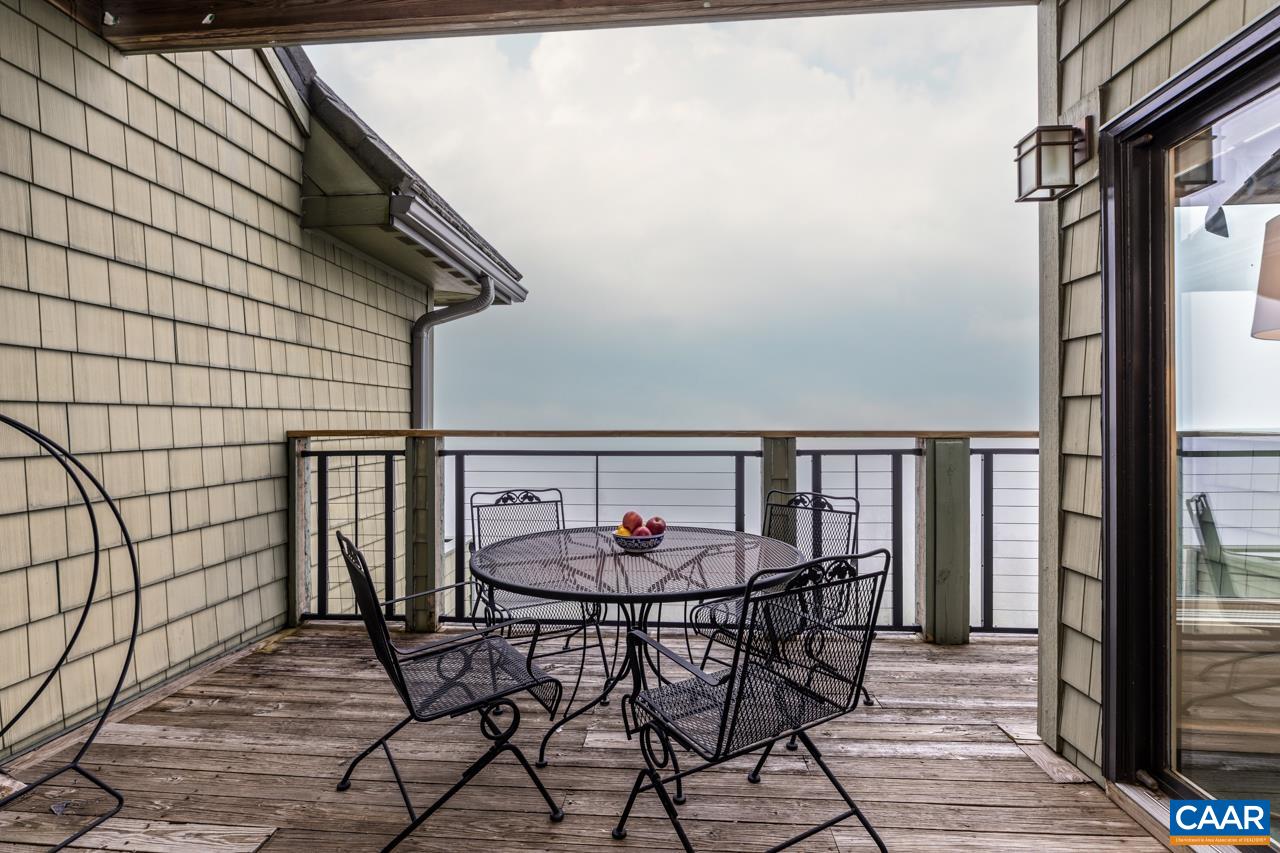 1706 High Ridge Wintergreen, VA 22967 - Photo 15 of 36 a table and chairs in a balcony
