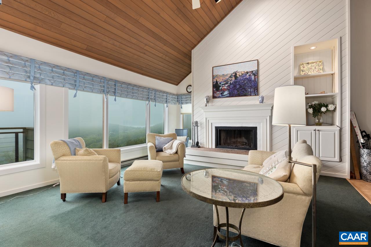 1706 High Ridge Wintergreen, VA 22967 - Photo 2 of 36 a living room with furniture a window and a fireplace