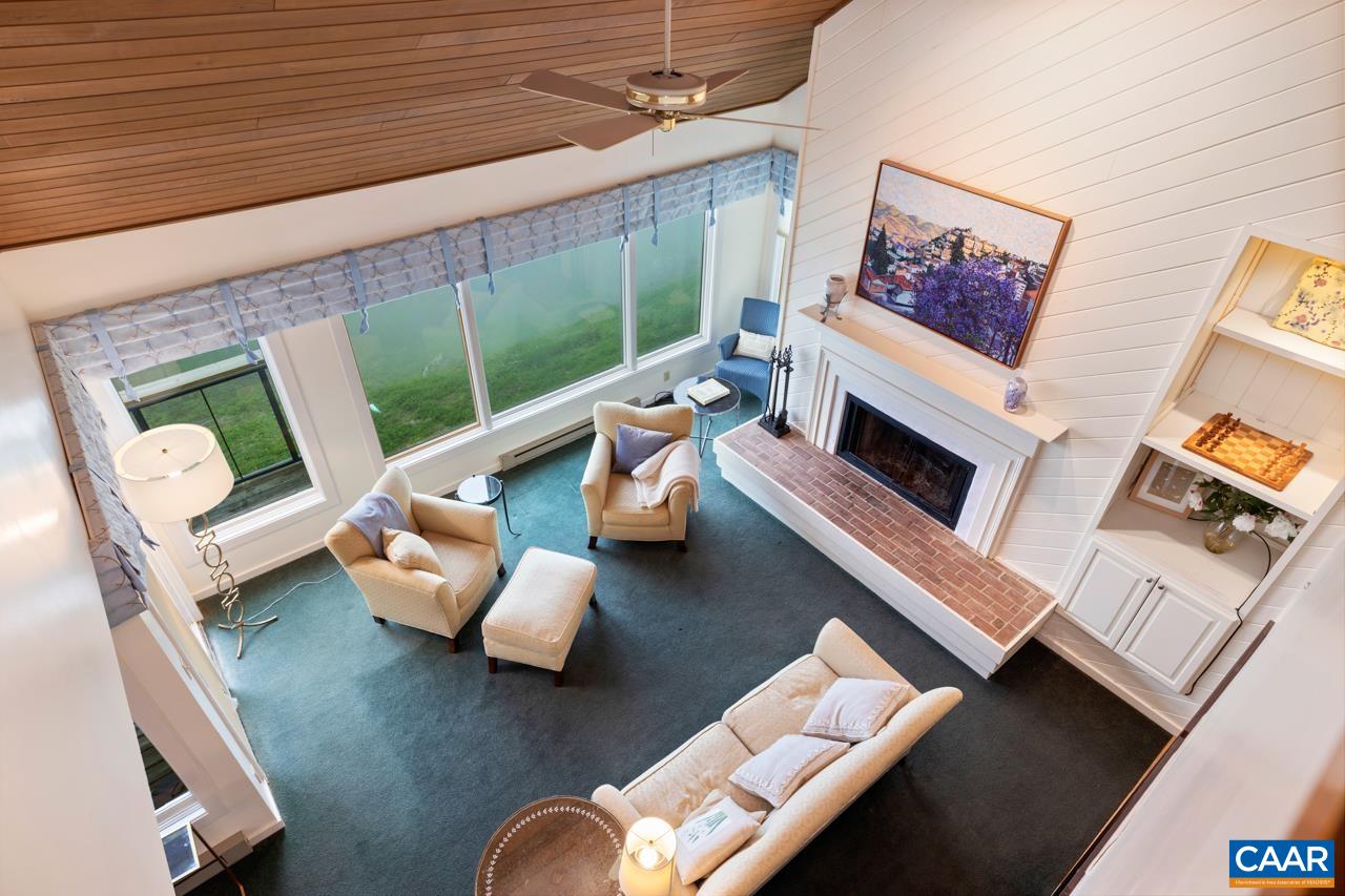 1706 High Ridge Wintergreen, VA 22967 - Photo 26 of 36 a living room with furniture and a floor to ceiling window
