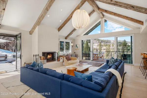 a dining room with furniture and wooden floor