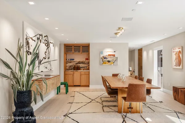a large kitchen with stainless steel appliances lots of counter space and a sink