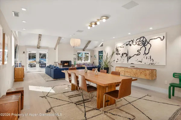 a bedroom with a large bed and a large window